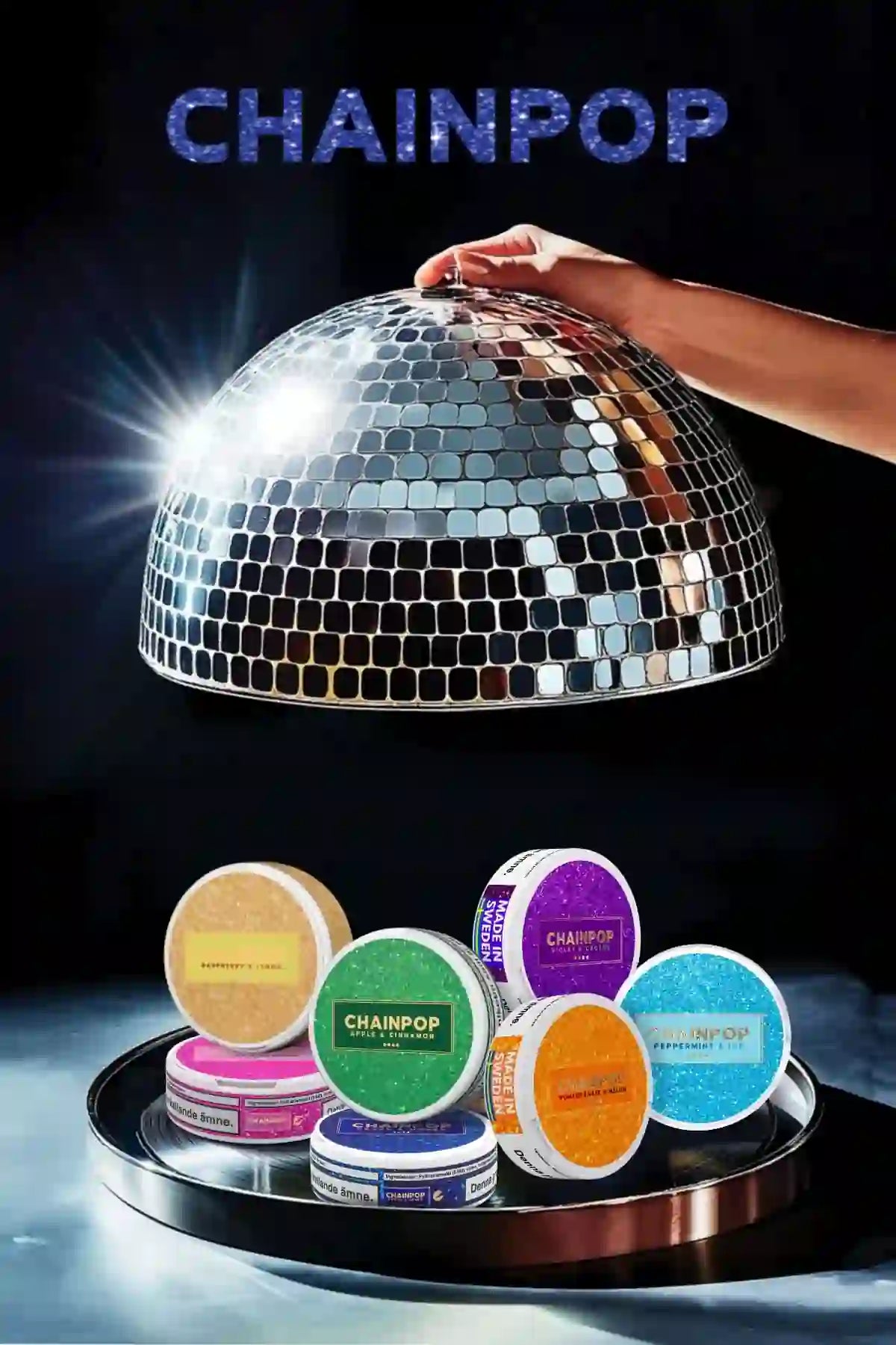 Display of Chainpop nicotine pouches in colorful cans on a tray under a disco ball with brand logo above.