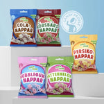 Front view of Candy People Sura Mini mixed candy – assorted fruity sour rings with cola, cherry, peach, watermelon, and bubblegum flavor.
